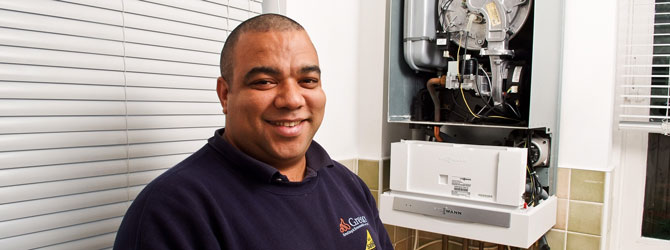 heating engineer with open boiler