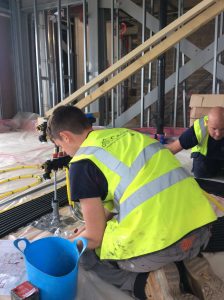 Father and son working in Poundbury 